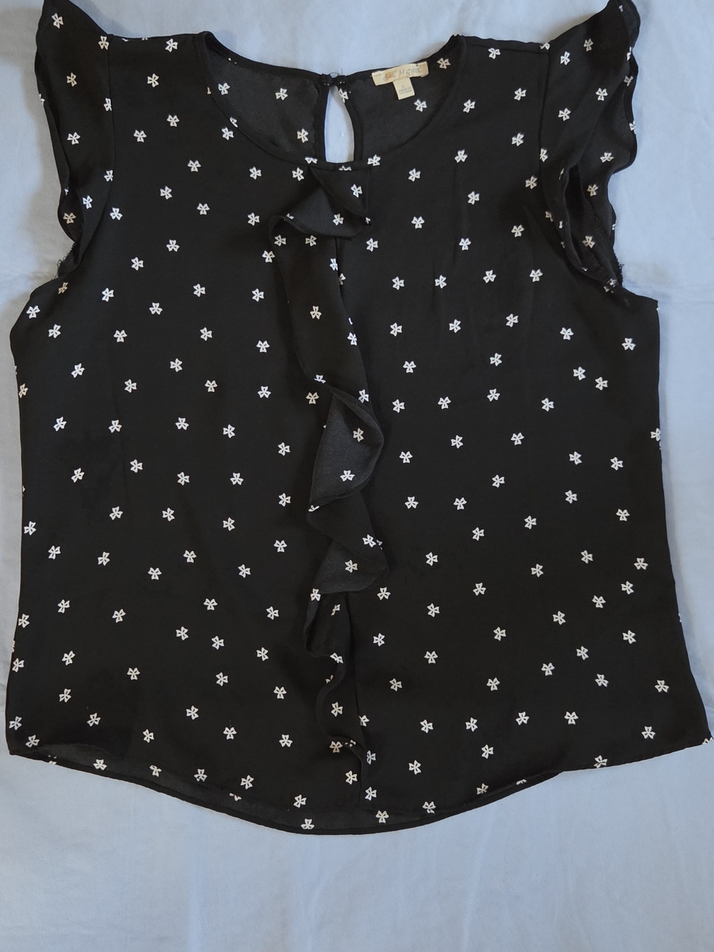 Michele Black Sleeveless Ruffle-Front Blouse with White Dot Floral
